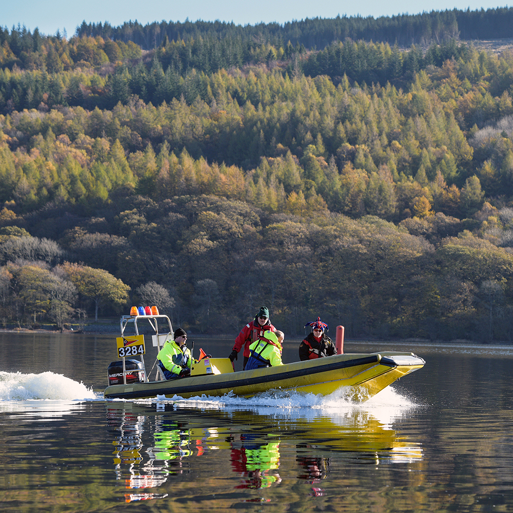 A safety boat on Coniston water and it's crew